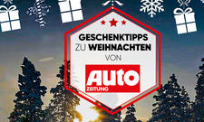 AUTO ZEITUNG-Logo vor weihnachtlichem Hintergrund